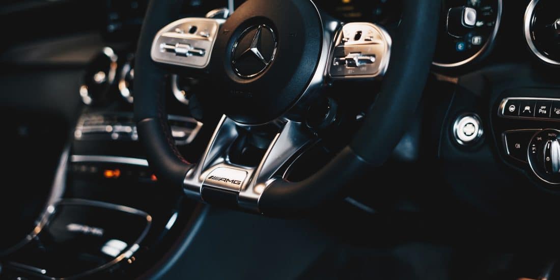 black Mercedes-Benz steering wheel